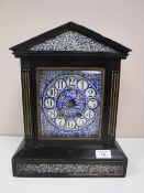 A Victorian ebonised cased mantel clock with blue porcelain dial