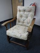 An oak barley twist button back adjustable armchair