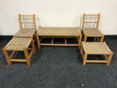 A pair of rush seated children's chairs together with three rush seated stools
