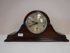 A mahogany cased mantel clock with silvered dial retailed by The Northern Goldsmiths Company of