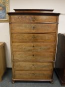 A continental mahogany seven drawer chest,