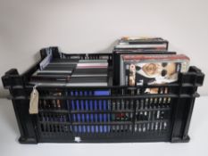 A box containing assorted DVD's and DVD boxsets