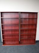 Two sets of DVD storage shelves in a mahogany finish