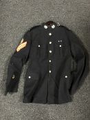 A Royal Marines military tunic with buttons and patches