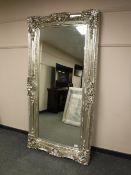 A large rectangular silvered mirror,