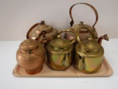 A tray of two copper kettles,