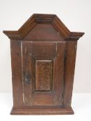A late 18th century oak wall cabinet
