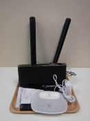 A tray containing a Sony Dream Machine Ipod dock with remote,