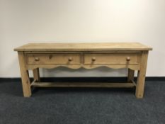 A reclaimed pine kitchen preparation table,