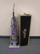 A Dyson DC 15 upright vacuum with box