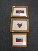 A pair of Roydon Astrop pictures in oak frames - hearts,