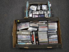 A box of approximately eleven digital cameras, DVDs,