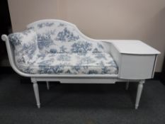 A white upholstered telephone table