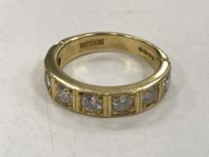 An 18ct gold seven stone half-eternity ring, approximately 1.4 carat, 5.