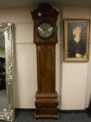 A nineteenth century mahogany longcase clock, with brass and silvered dial,