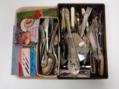 A tray containing a quantity of boxed and unboxed table cutlery stainless steel little forks,