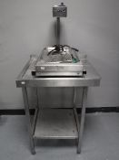 A stainless steel two tier preparation table,