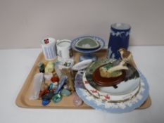 A tray containing commemorative mugs, Wedgwood Jasper ware, rock samples, wall plates,