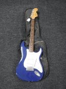 A Squire Strat by Fender electric guitar in carry bag