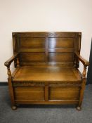 A 1920's oak monk's bench,