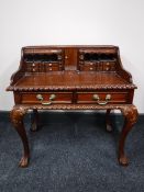 A Victorian style mahogany child's writing desk