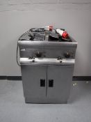 A Lincat stainless steel double fryer (three bays)