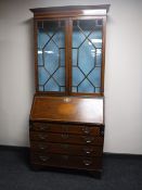 A Victorian inlaid mahogany bureau bookcase