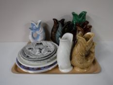 A tray containing collection of twelve pottery fish jugs and assorted wall plates including Home