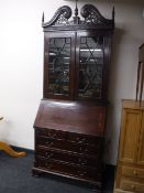 A Victorian style mahogany bureau bookcase