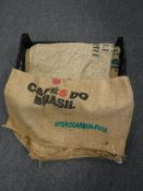 A crate containing seven Hessian coffee sacks