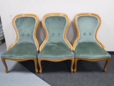 A set of three pine frame lady's chairs upholstered in a green dralon