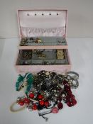 A jewellery box containing a quantity of costume jewellery together with a 9ct gold ring and a