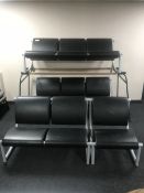 A four-piece Clober black leather and metal reception suite comprising of two three-seater settees,