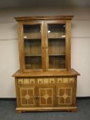 A Barker and Stonehouse Flagstone glazed double door bookcase,