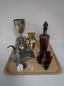 A small collection of silver plate, including three goblets, a sugar helmet with scoop and a teapot,