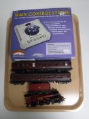 A Hornby 00 Gauge Hogwarts Express with two carriages and a Bachmann train control system