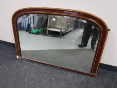 An antique mahogany overmantel mirror