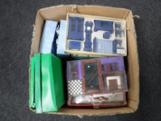 A box containing assorted dolls furniture