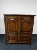 A contemporary oak audio cabinet