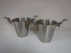 A pair of ice buckets with stags head handles