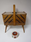 A concertina sewing box and contents