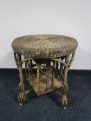 A circular wicker book table