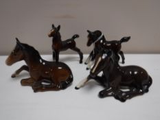 Four Beswick foal figures (brown gloss)