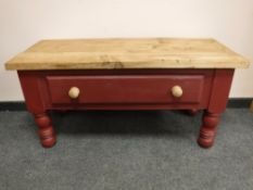 A reclaimed pine low table, fitted with a drawer,