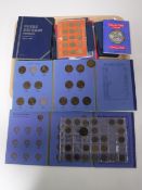 A tray containing a collection of twentieth century British coinage, coin collecting guides,