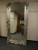 A large rectangular ornate mirror,