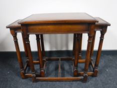 A nest of three contemporary mahogany tables