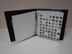 A coin album containing foreign coins