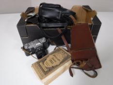 A box of vintage cameras, cine cameras,