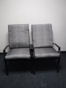 A pair of metal adjustable garden loungers with cushions